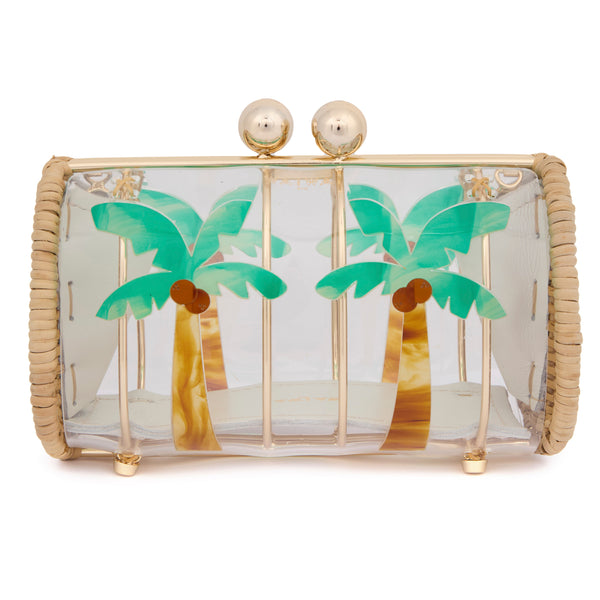 Clutch estruturada em rattan com corpo em acrílico transparente, estampa de duas palmeiras verdes com troncos marrons e fecho metálico dourado no topo.