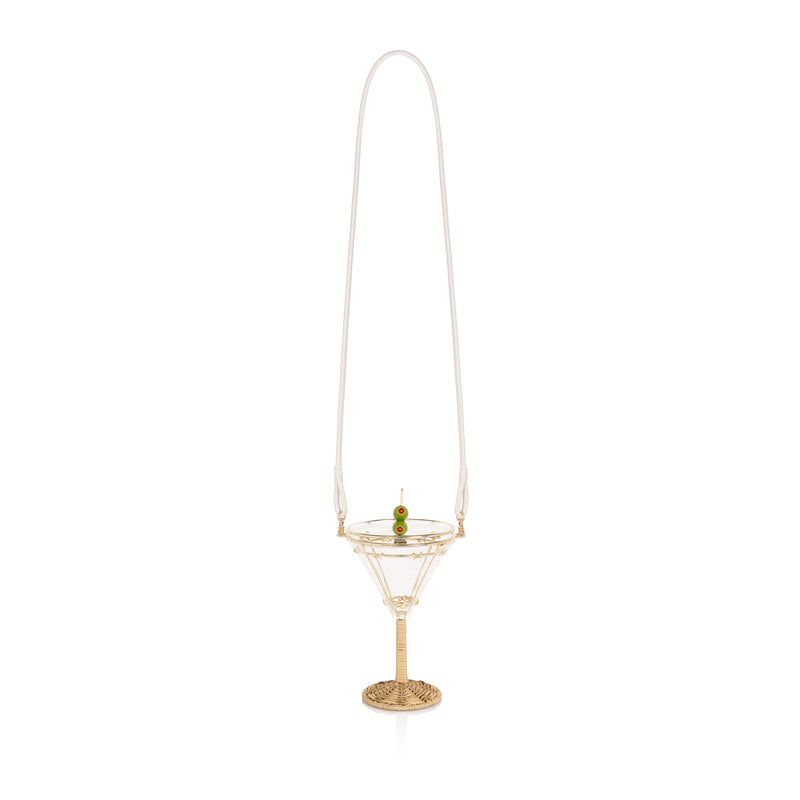 Bolsa em formato de taça de martini com base em rattan trançado, corpo em acrílico transparente com detalhes dourados e fecho divertido em formato de azeitona verde.