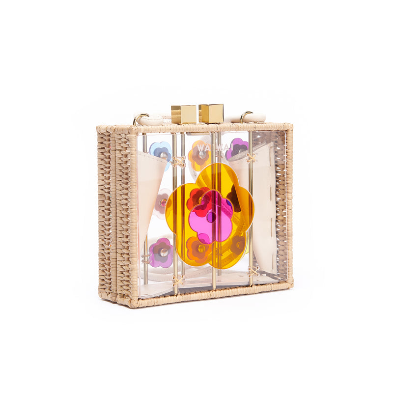 Bolsa estruturada transparente com alça curta, decorada com flores em acrílico colorido e cristais centrais.